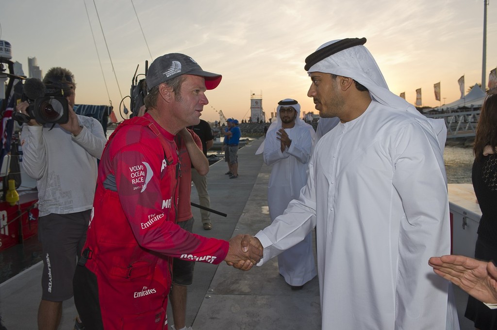 Camper with Emirates Team New Zealand skipper Chris Nicholson is congratulated by Highness Sheikh Sultan Bin Tahnoon Al Nahyan, Chairman of Abu Dhabi Tourism Authority on the dock at the end of leg two. Volvo Ocean Race 2011-2012.  © Emirates Team New Zealand http://www.etnzblog.com